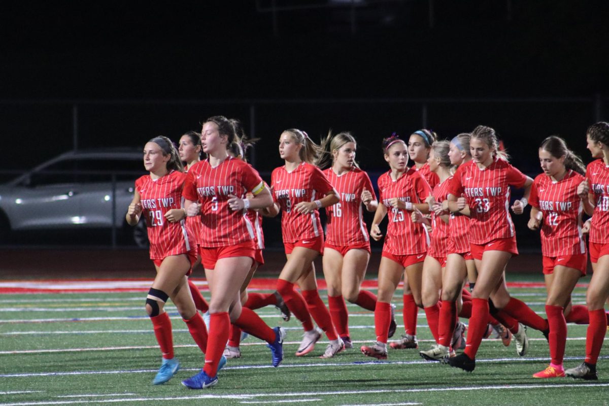 The undefeated girls' soccer team takes the field before a home game.